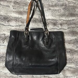 This is a vintage Coach Legacy Hampton Gallery black leather tote.